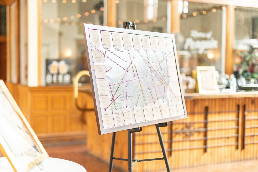 peach and sage wedding in canfield, ohio at and the b&o station banquet hall table map at reception