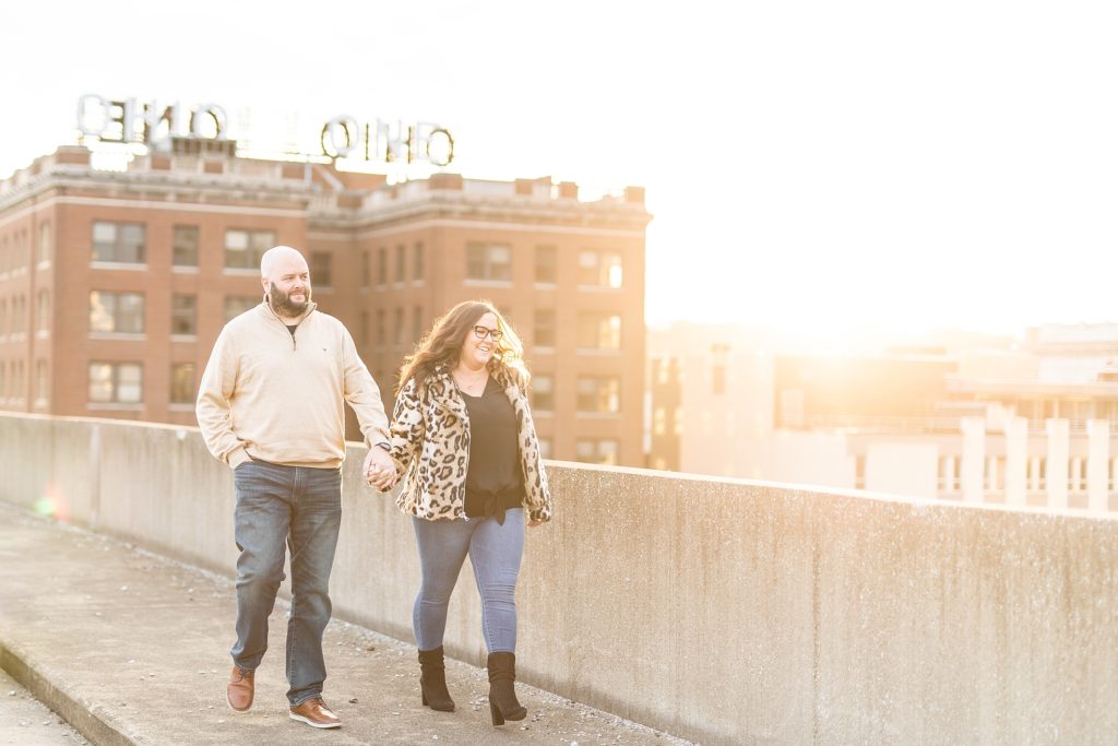 Fall city rooftop engagement in Youngstown Ohio during sunset