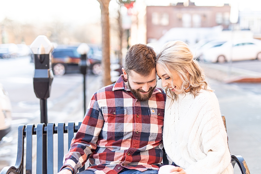 Engaged couple sitting and talking outside Tree City Coffee in Kent, Ohio.