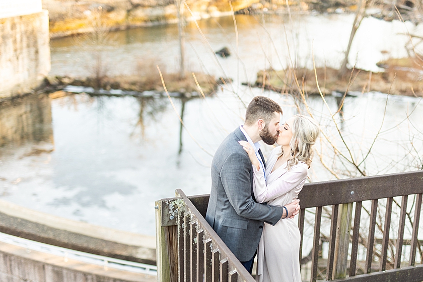 Couple kissing over lake outlook in Kent, Ohio.
