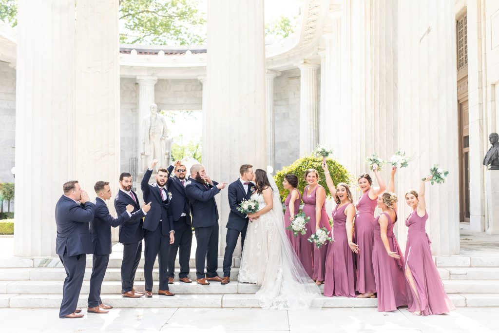 Luxury Mauve and navy summer June wedding at McKinley Memorial Library in Niles Ohio of bridal party on steps. Youngstown, Ohio wedding at Crossroads Church and reception at Divieste's in Warren, Ohio.