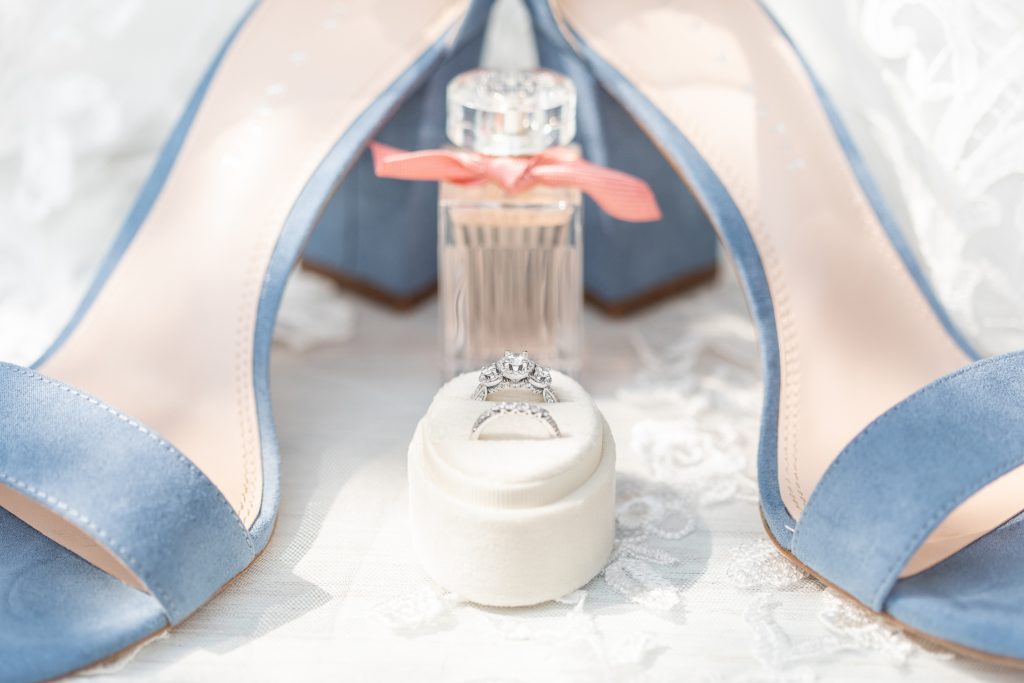 Samantha and Matthew Simko's Hudson, Ohio summer wedding at Highfield Event Center photographed by Bree Thompson Photography serving San Diego Luxury Wedding Photographer. Bridal shoes, wedding rings, bridal perfume, and veil lace.