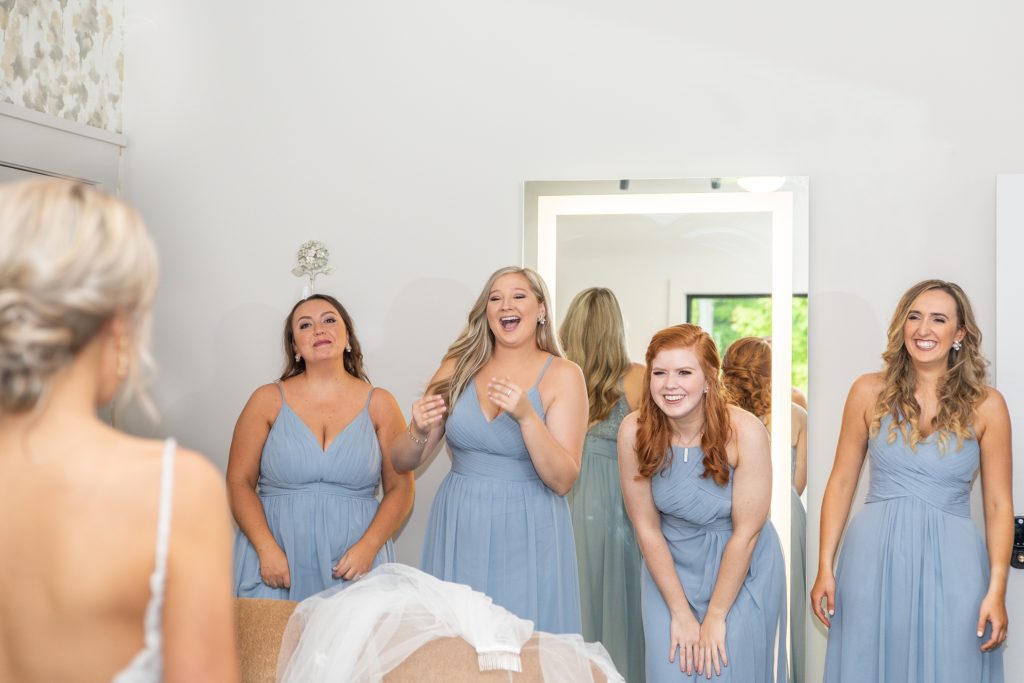 Samantha and Matthew Simko's Hudson, Ohio summer wedding at Highfield Event Center photographed by Bree Thompson Photography serving San Diego Luxury Wedding Photographer. Bridesmaids first look with bride.