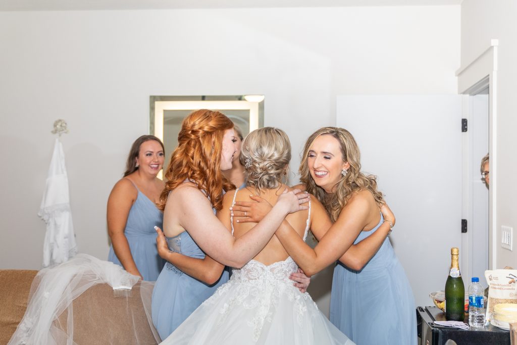 Samantha and Matthew Simko's Hudson, Ohio summer wedding at Highfield Event Center photographed by Bree Thompson Photography serving San Diego Luxury Wedding Photographer. Bride and Bridesmaids first look getting ready together.