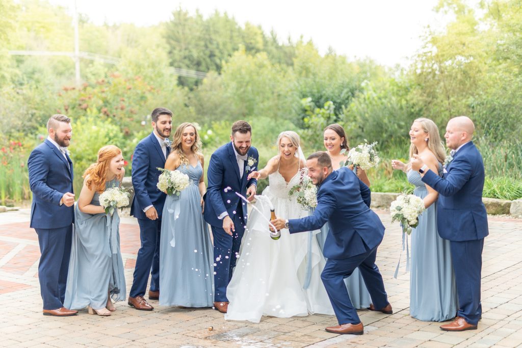 Samantha and Matthew Simko's Hudson, Ohio summer wedding at Highfield Event Center photographed by Bree Thompson Photography serving San Diego Luxury Wedding Photographer. Bridal party champagne photo.