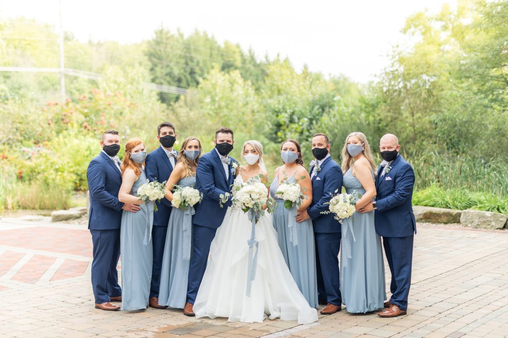 Samantha and Matthew Simko's Hudson, Ohio summer wedding at Highfield Event Center photographed by Bree Thompson Photography serving San Diego Luxury Wedding Photographer. Corona Virus bridal party picture with masks.