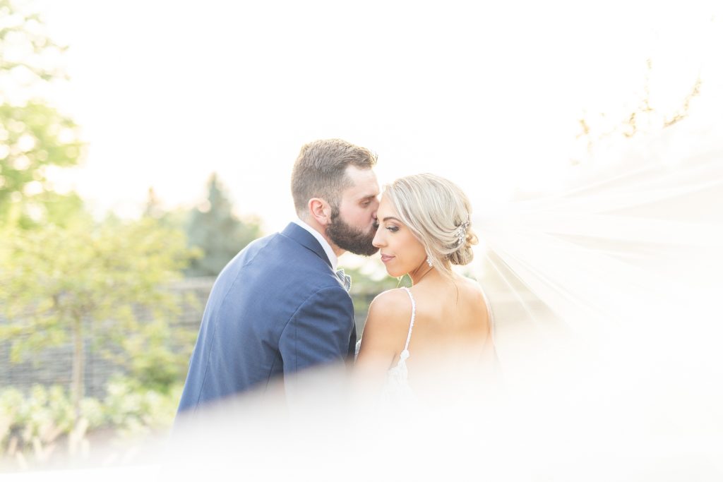 Samantha and Matthew Simko's Hudson, Ohio summer wedding at Highfield Event Center photographed by Bree Thompson Photography serving San Diego Luxury Wedding Photographer. Bride and Groom sunset photo.
