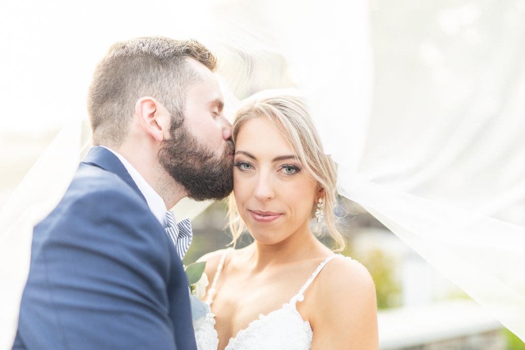 Samantha and Matthew Simko's Hudson, Ohio summer wedding at Highfield Event Center photographed by Bree Thompson Photography serving San Diego Luxury Wedding Photographer. Bride and groom sunset veil photos.