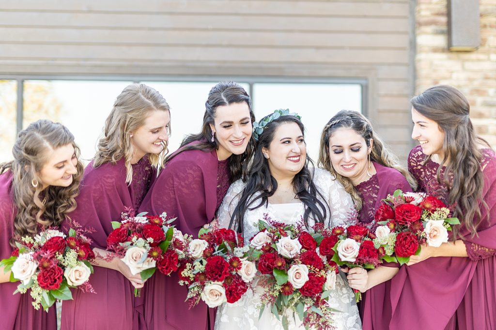 Burgundy and red fall wedding by Bree Thompson Photography at The Vineyards at Pine Lake.