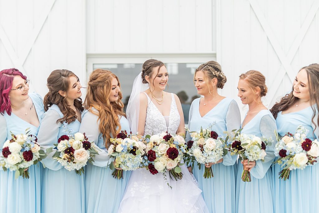Luxury wedding photographer, Bree Thompson, photographs blue and red autumn wedding details at White Rose Barn in Ohio.