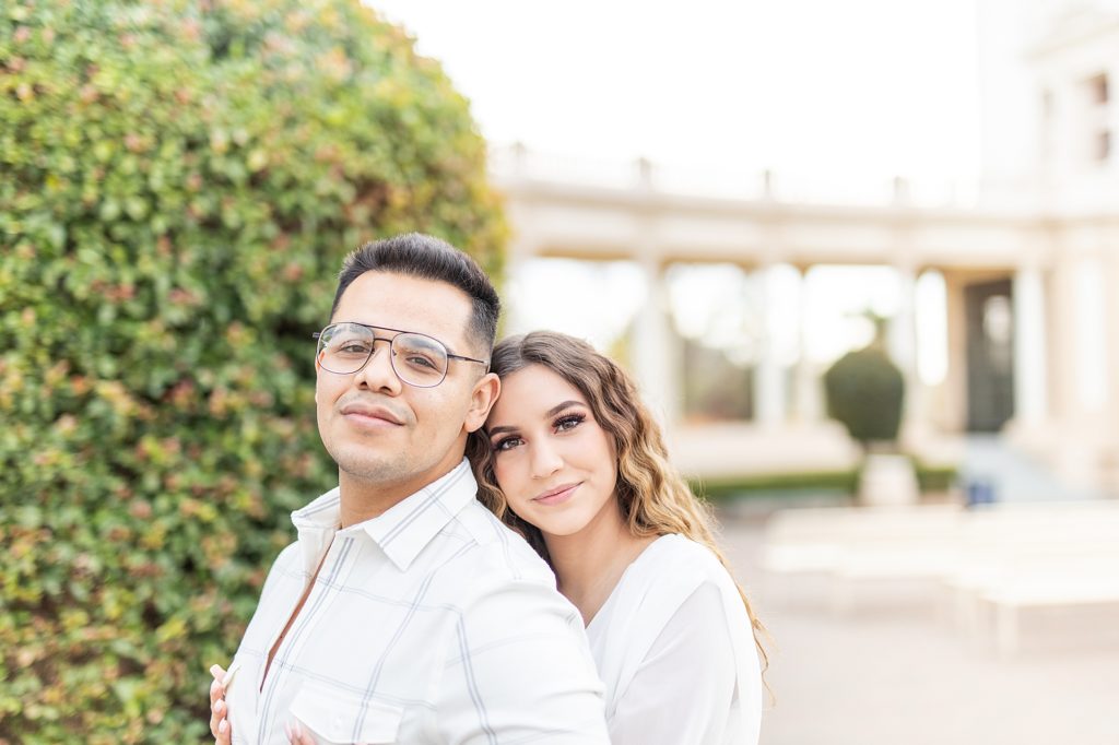Sunset engagement session at Balboa Park in San Diego, California wearing white dress and yellow heels.