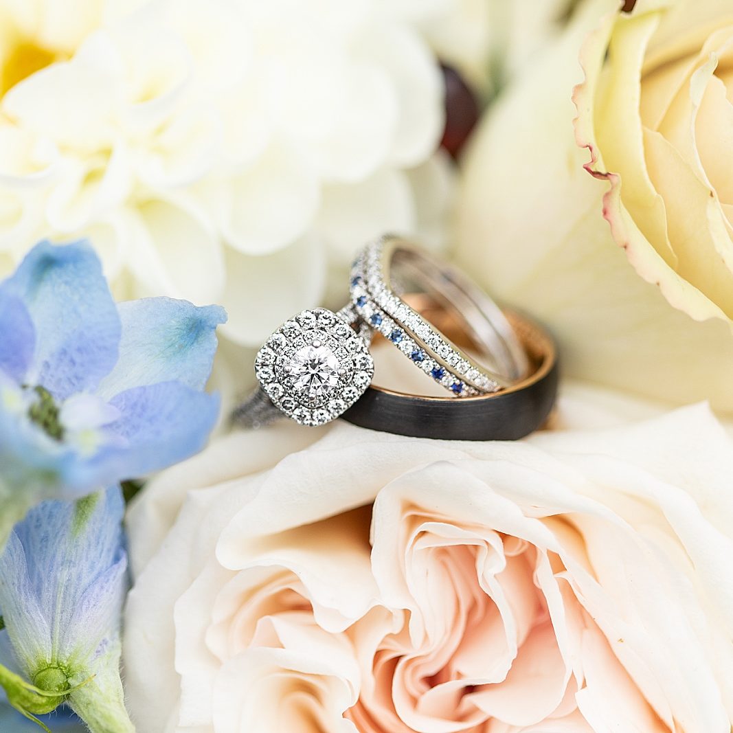 Engagement ring and bride and groom wedding bands photographed by Bree of Sherr Weddings based in San Diego, California.