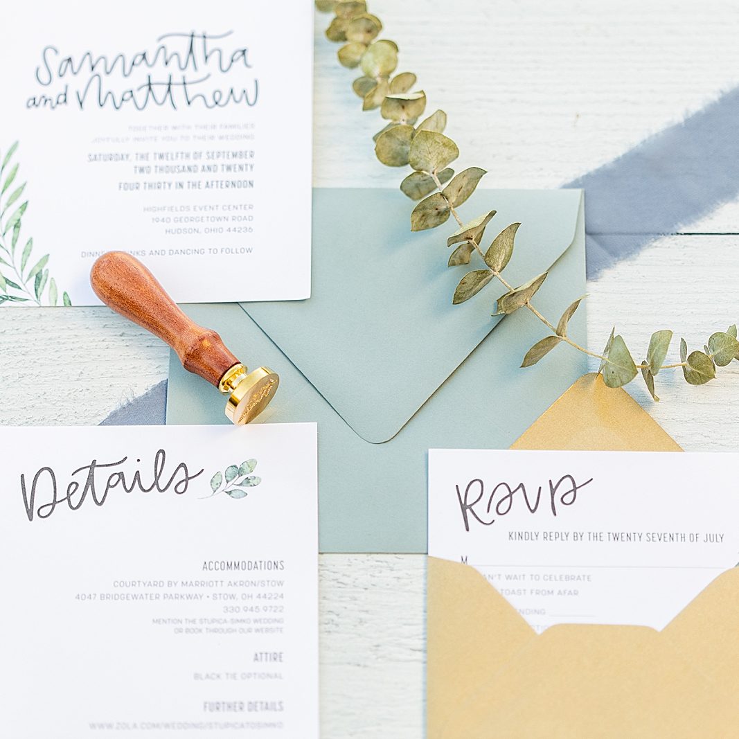 Blue and gold wedding invitation suite detail photographed by Sherr Weddings based in San Diego, California.
