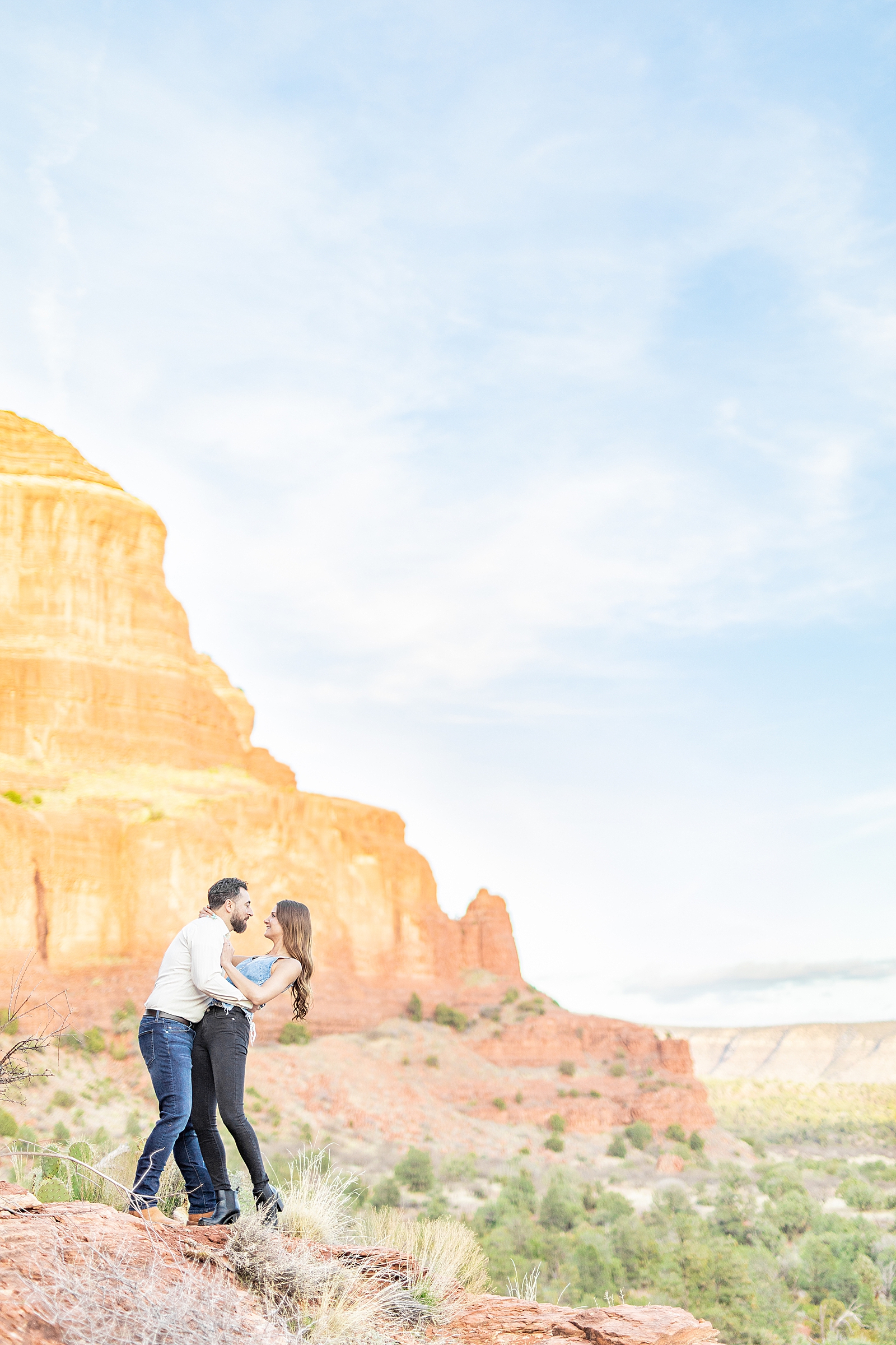 Couple dancing on a cliff at Bell Rock in Sedona, Arizona photographed by Sherr Weddings.