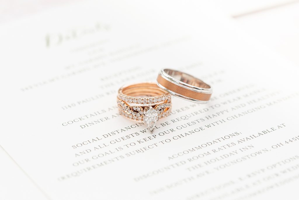 Wedding rings on minted wedding invitation.