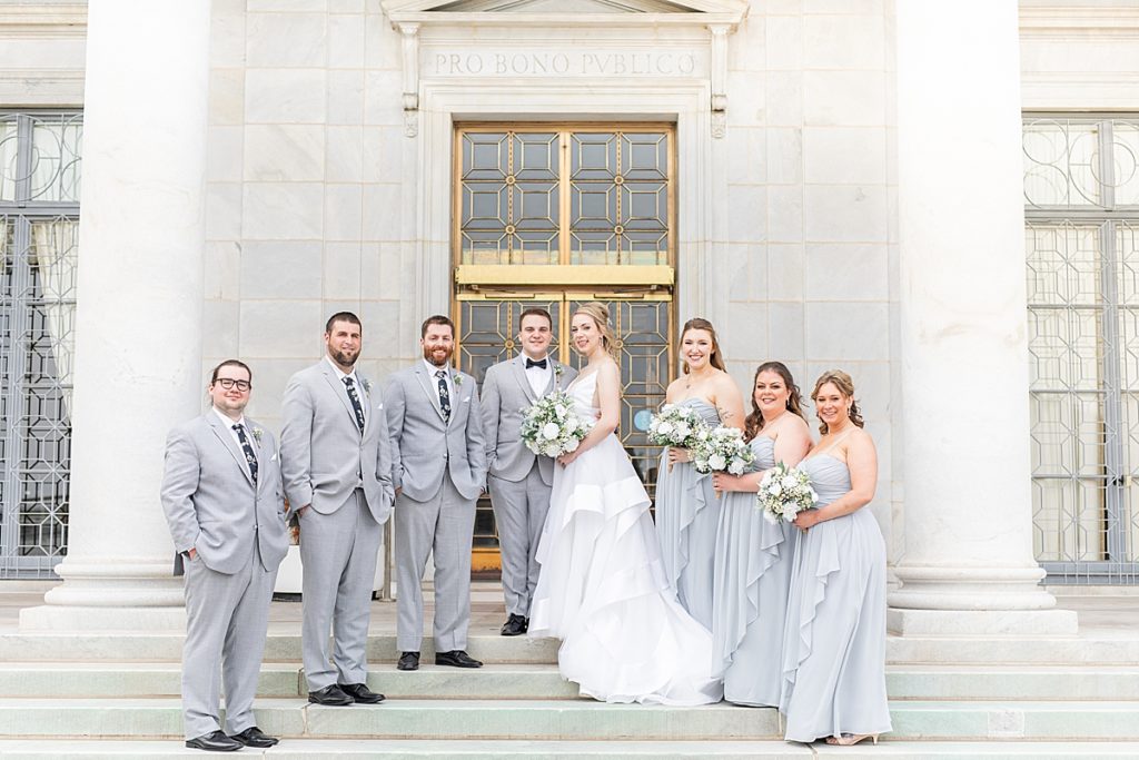 Groom with groomsmen and bride with bridesmaids before the wedding at the Lake Club of Ohio.