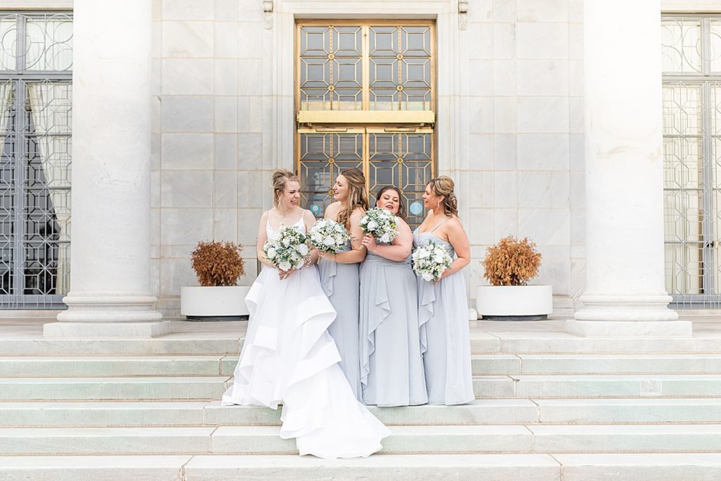 Bride and bridesmaids laughing at The Butler Institute of American Art.