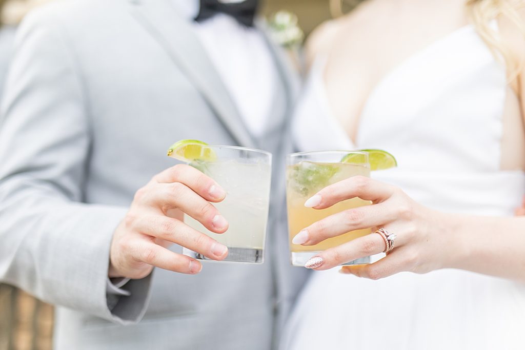 Bride and groom holding moscow mules photographed by Sherr Weddings.