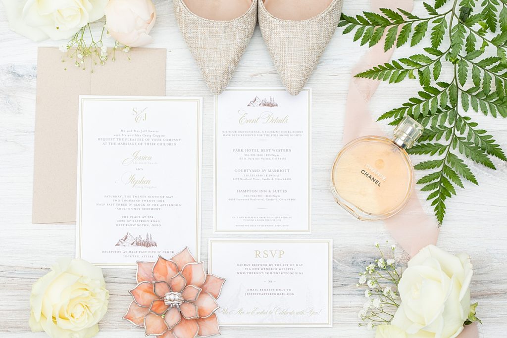 Wedding rings, invitations, and roses photographed by Bree Thompson based in San Diego.