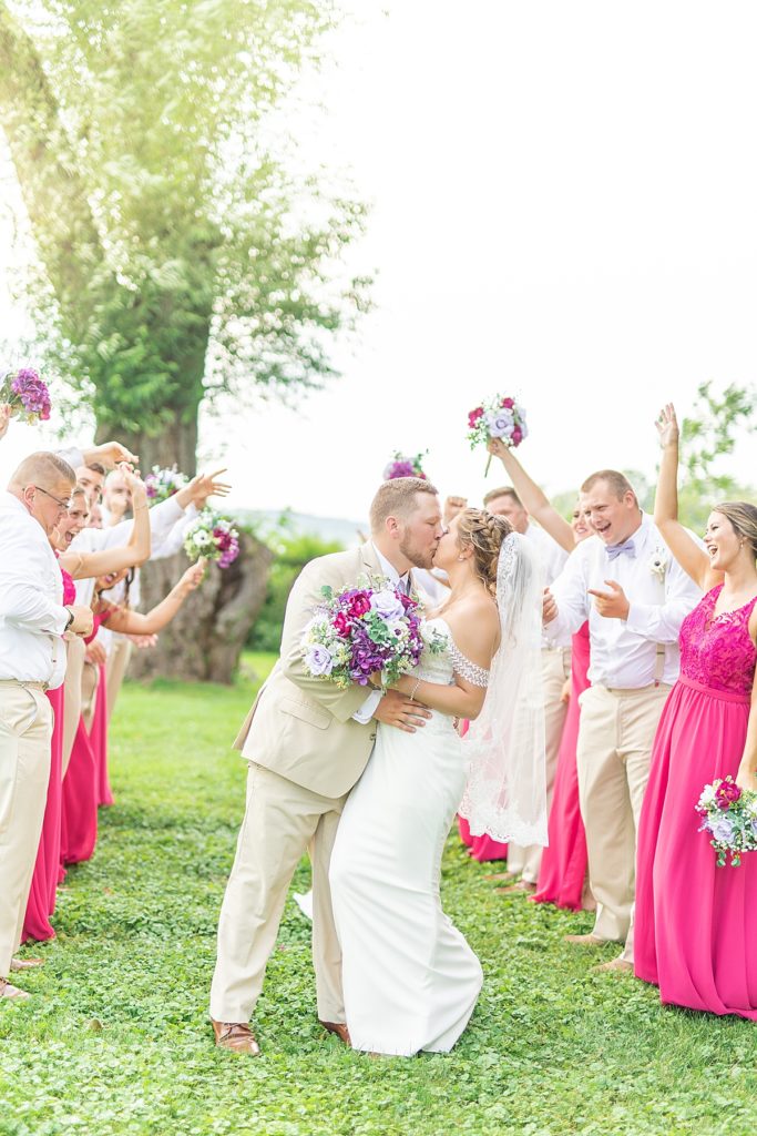Colorful magenta and purple wedding day overlooking a lake.