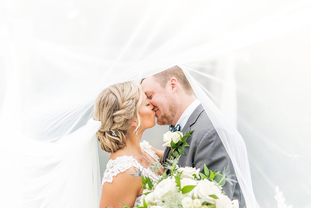 California wedding photographer, Sherr Weddings, captures the bride and groom’s first kiss during the ceremony.