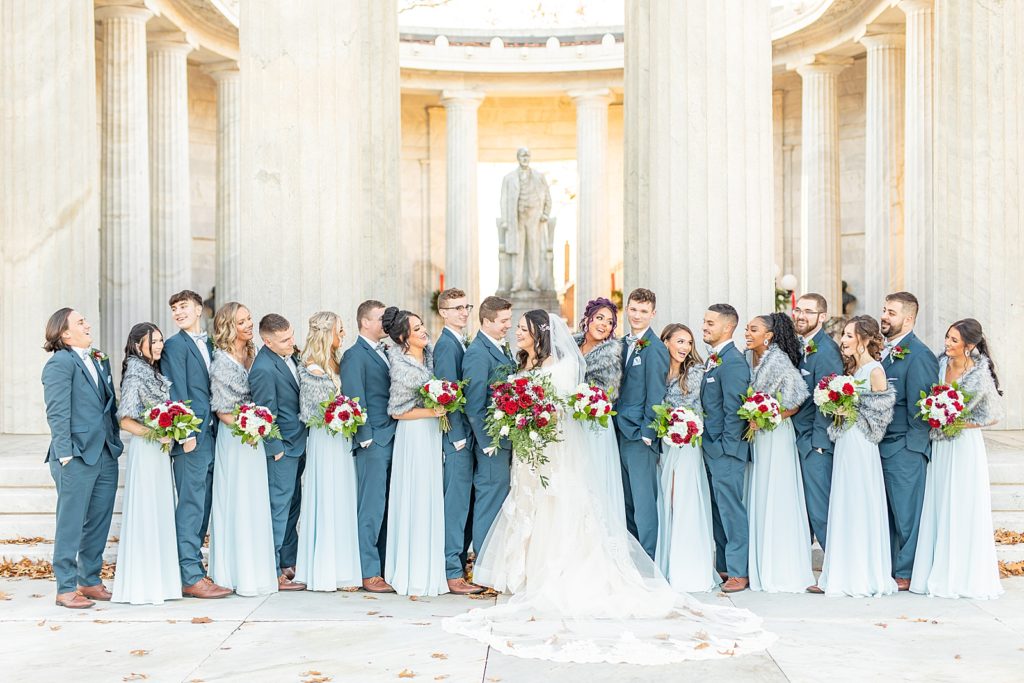 Blue Bridesmaids dresses from Azazie and Groomsmen suits from Rondinelli Tuxedo Company.