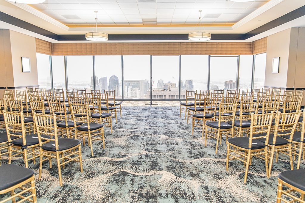 Wedding Ceremony with golden chairs overlooking San Diego Harbor.