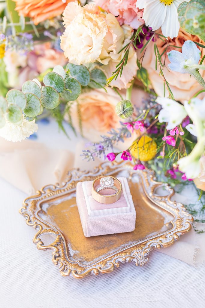 Navy, champagne, peach, lilac, and green florals photographed Bree & Hayes Sherr.