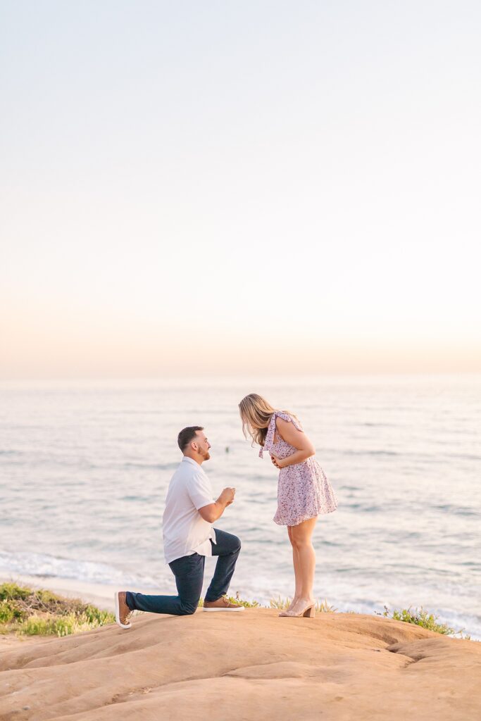 Bride surprised by groom's proposal over the ocean by Bree Sherr.
