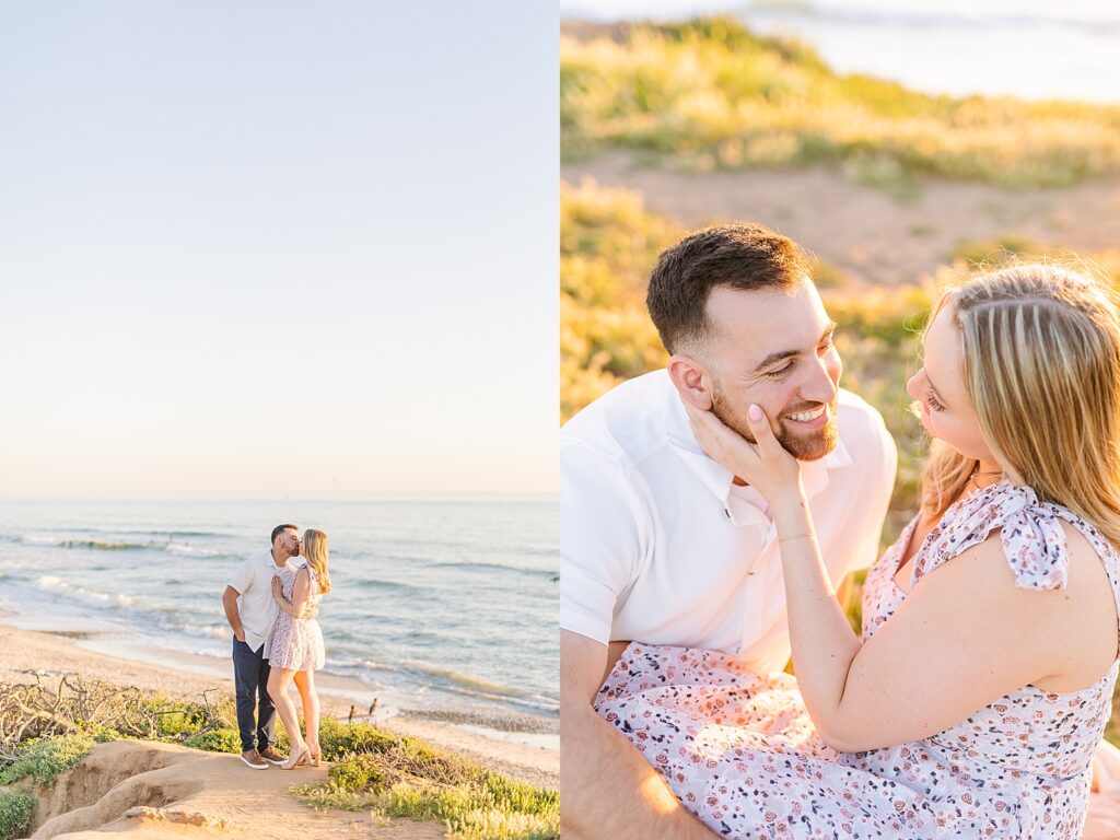 Engaged couple kissing and smiling at each other on the cliffs of Carlsbad beach photographed by Sherr Weddings.