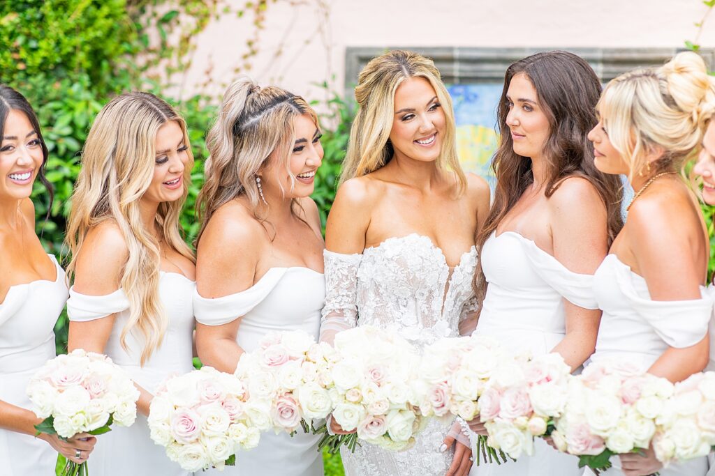 The bride and her bridesmaids laughing together in San Diego.