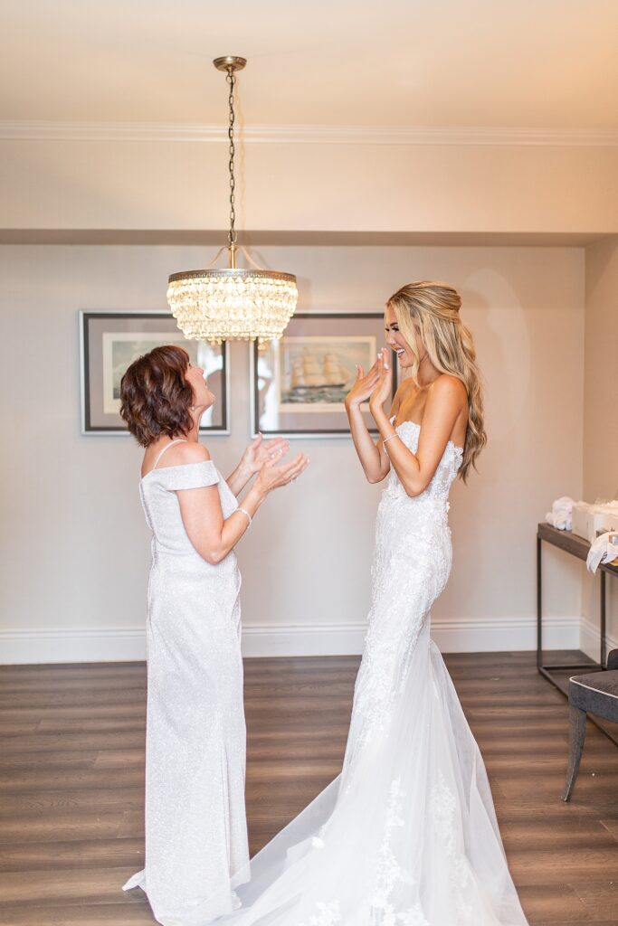 Bride and her mom sharing tears and smiles while getting ready in La Valencia's bridal suite.
