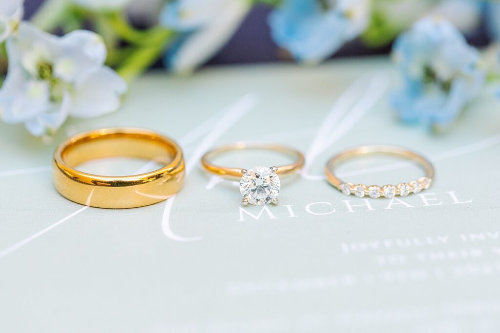 Bride and groom engagement and wedding rings on wedding invitation at Havasu Springs Resort.