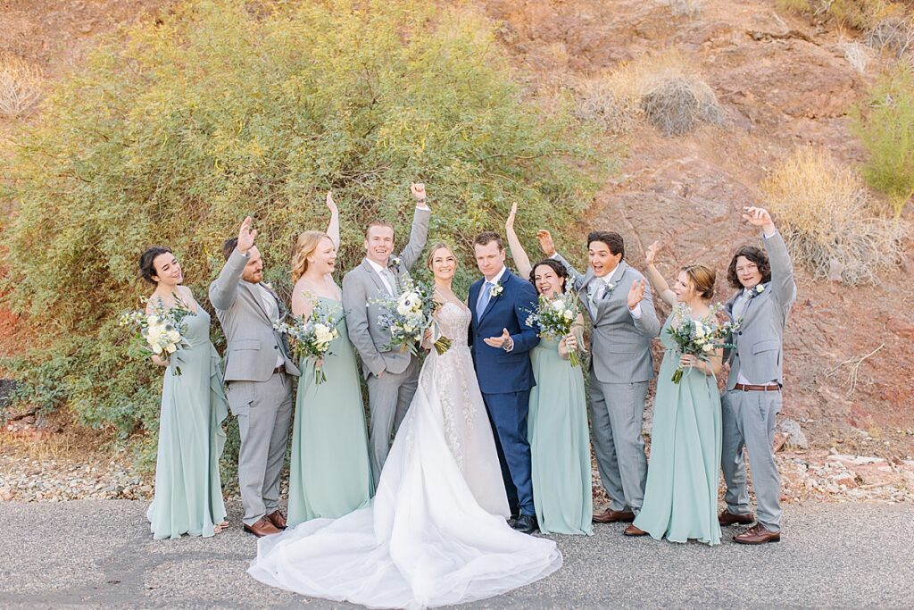 Bridal party cheering on the bride and groom on their wedding day at Havasu Springs Resort in Parker, Arizona.