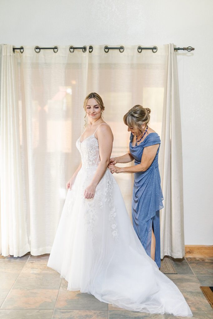 Bride in couture lace gown from Natty Bella Bridal in Oceanside, California.
