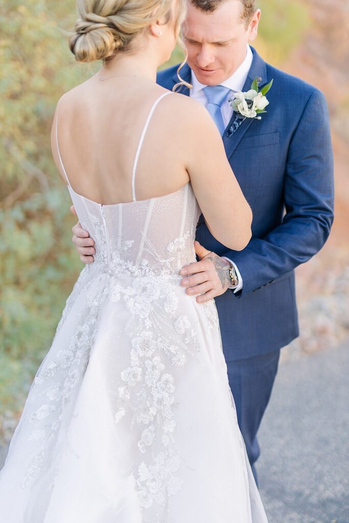 Bride and groom sharing a moment during their first look at Havasu Springs Resort.