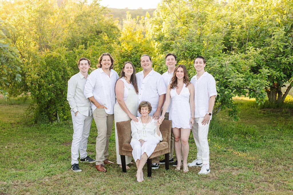 Grandma and grandkids taking photo in private estate orchard in Temecula, California.