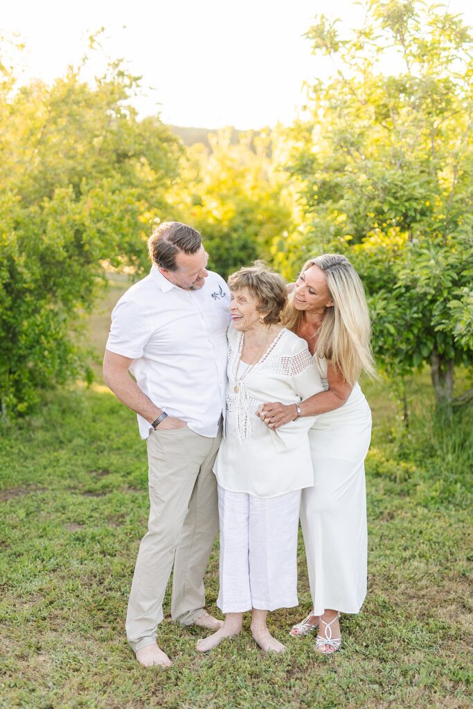 Grandma Kinnel and her children laughing in the orchard of a private estate in Murietta in Riverside County.