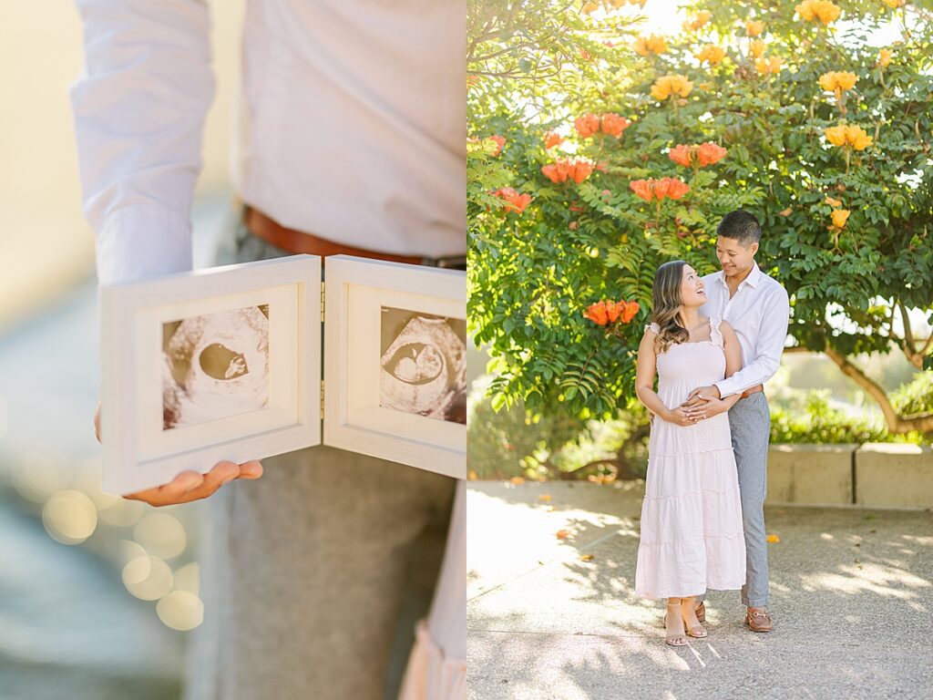 Asian couple enjoying a maternity photo session at Scripps Pier in La Jolla, with the woman wearing a pink ruffled dress and the man in a white button-down shirt and pants, standing by the beach at sunset.