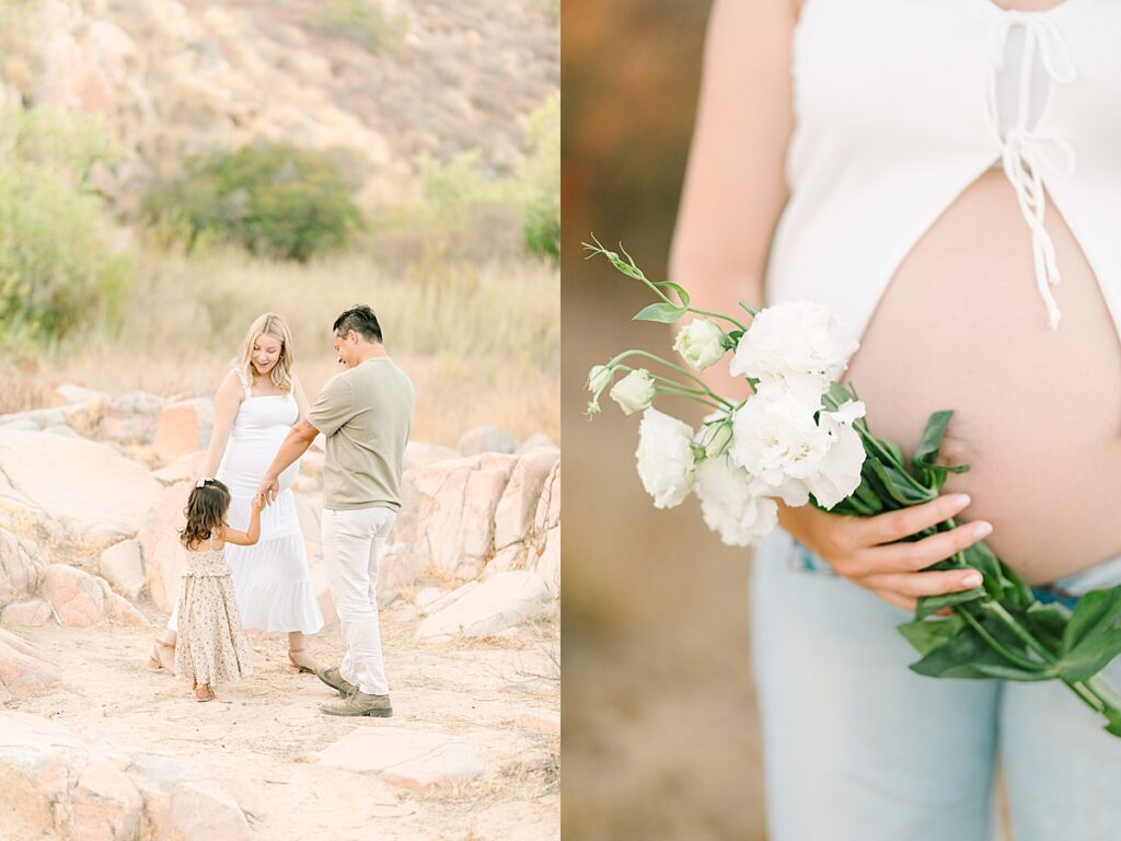 Family playing ring around the rosie while mom holds her pregnant belly with flowers.